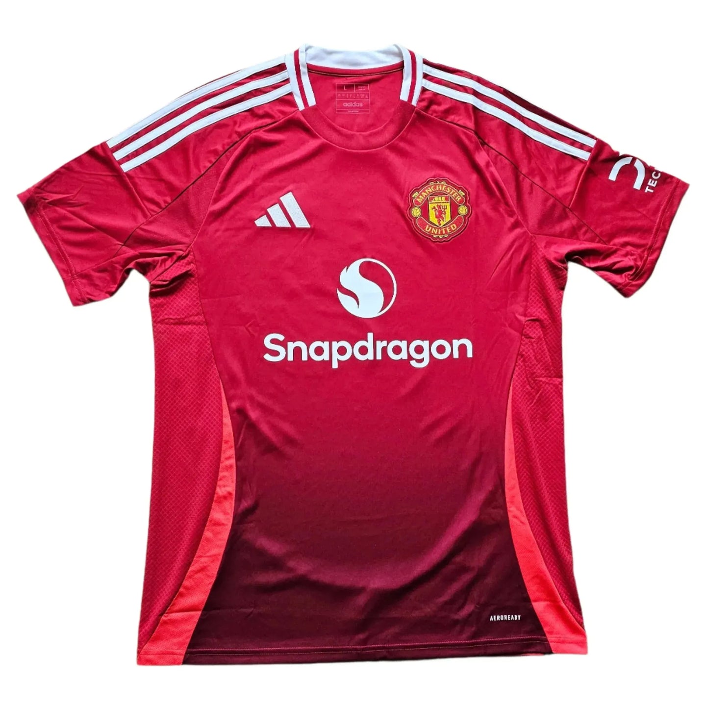 Front view of Leny Yoro Manchester United signed football shirt featuring crest and sponsor logo.
