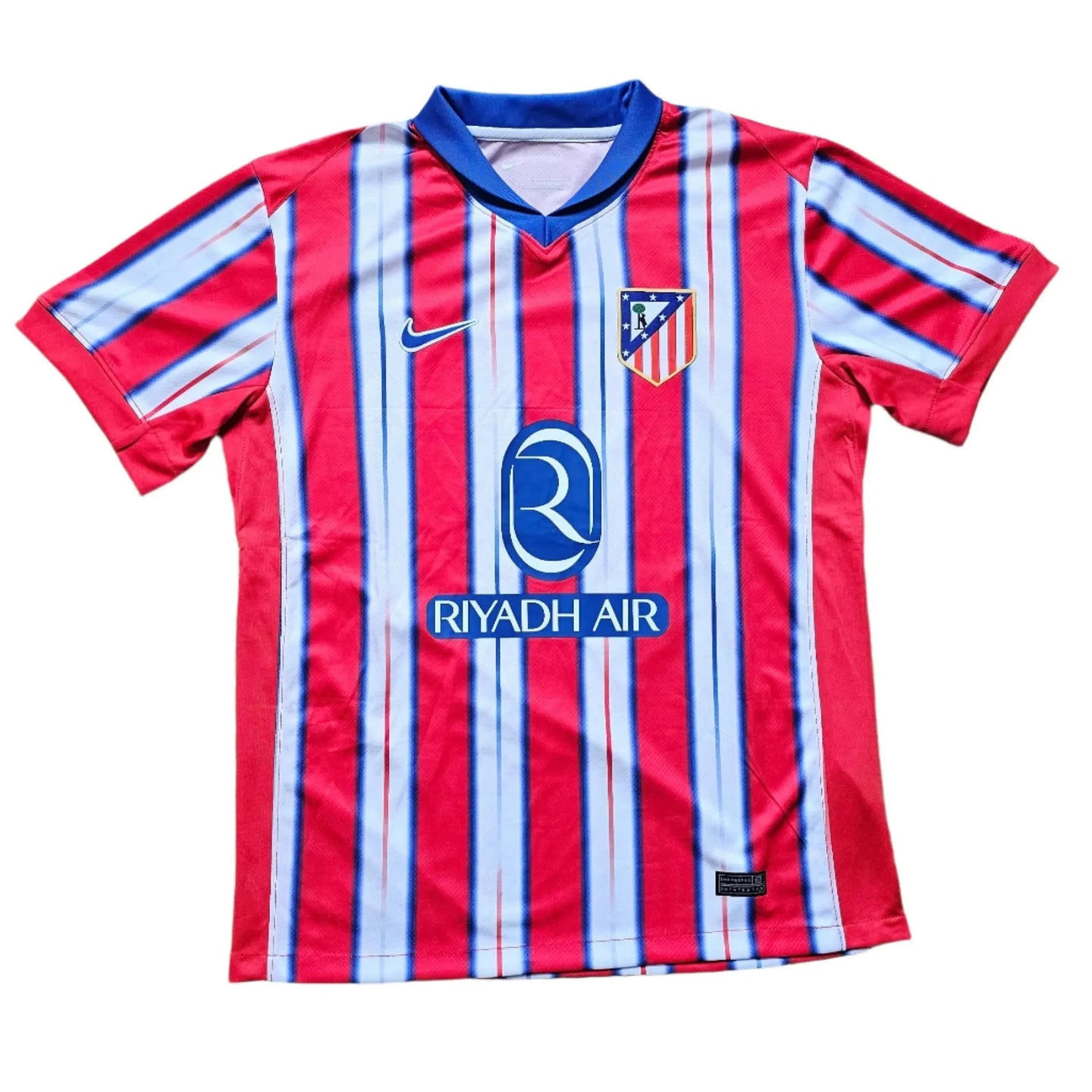 Front view of Ángel Correa 10 Atlético Madrid signed football shirt with red and blue stripes, featuring the club crest and 'RIYADH AIR' sponsor.