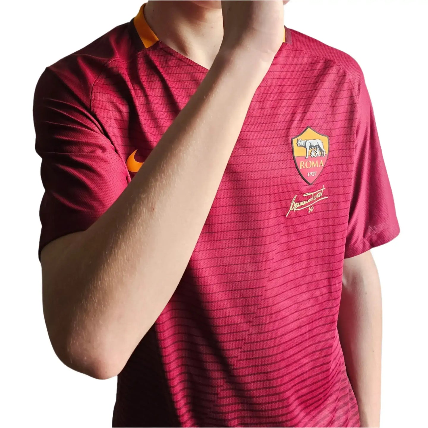 Back view showing Francesco Totti signature and No. 10 on a red Roma football shirt.