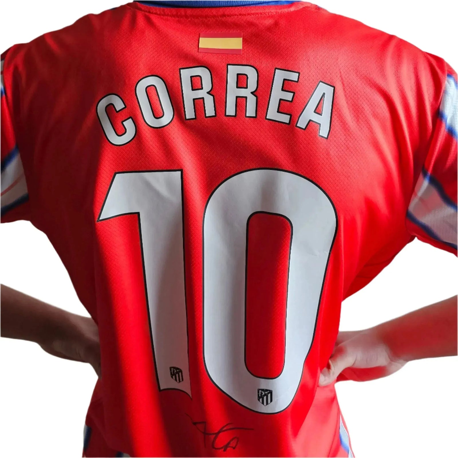 Back view showcasing the name CORREA, number 10, and a visible signature on a red football shirt.