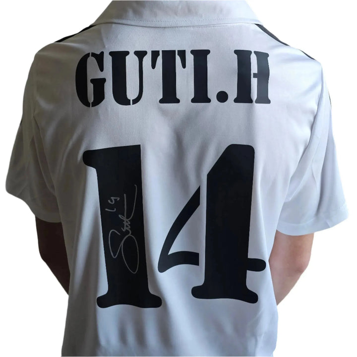 Back view featuring Guti's name and No. 14 along with a visible signature.