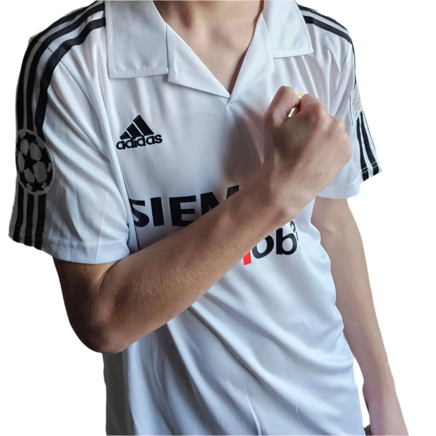 Close-up view of Guti 14 Real Madrid football shirt featuring the adidas logo and UEFA Champions League badge.
