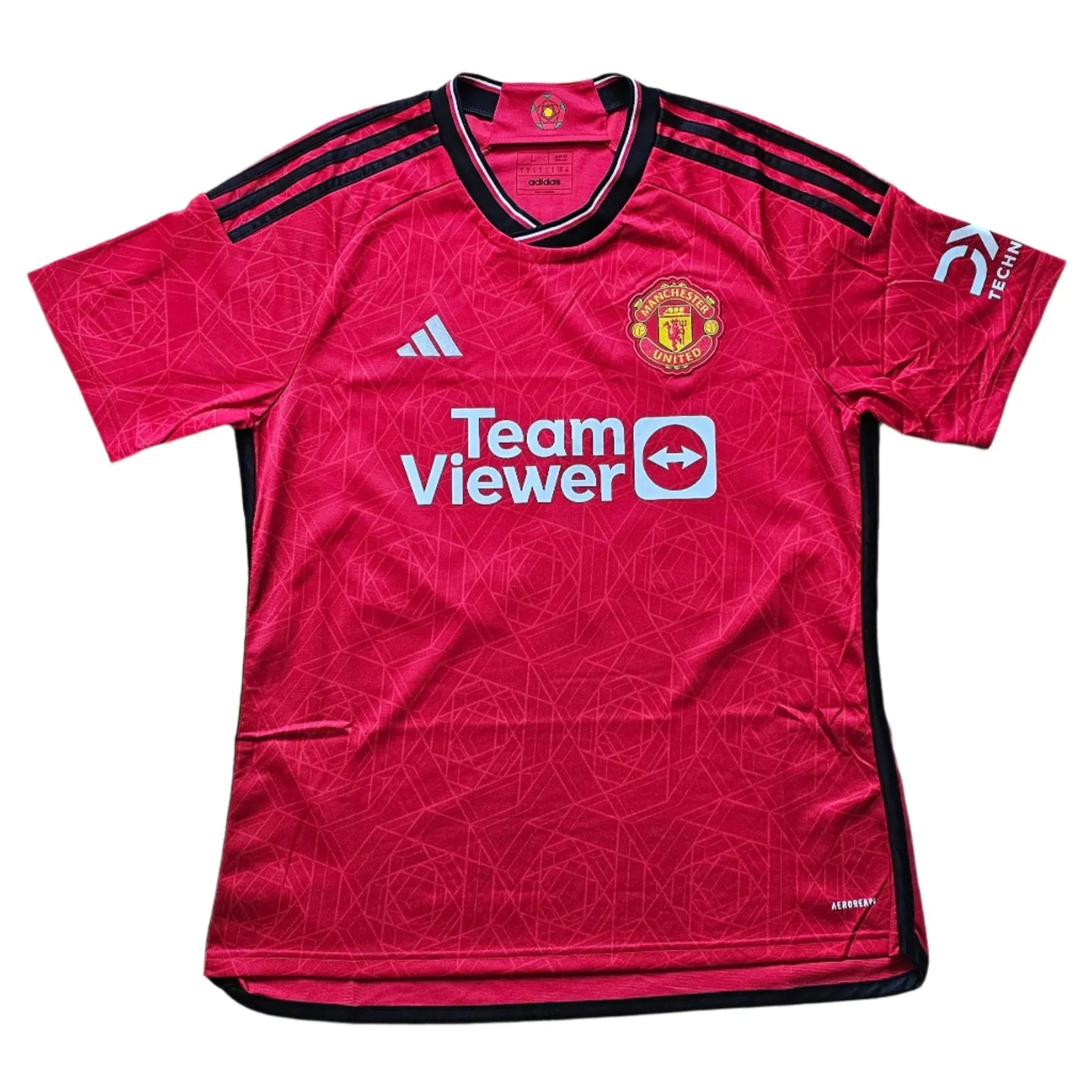 Front view of red Manchester United football shirt featuring crest and 'Team Viewer' sponsor.