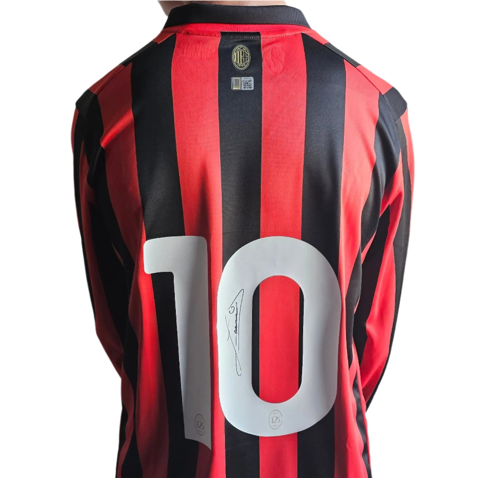 Back view showing No. 10 and signature on red and black striped shirt.