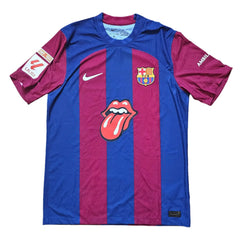 Back view showing the distinctive Rolling Stones logo and FC Barcelona crest in blue and red.