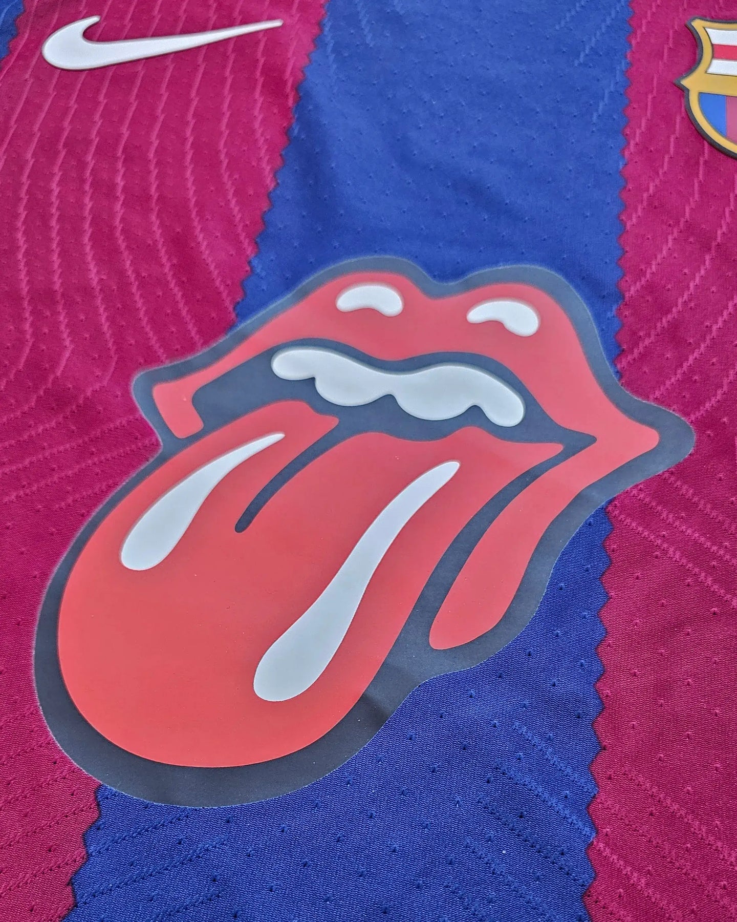 Close-up of the Barcelona 2024 ROLLING STONES shirt showing the iconic Rolling Stones logo and crest.