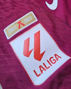 Detail view of LaLiga patch displaying the seasons 2022 and 2023 on a Barcelona shirt.
