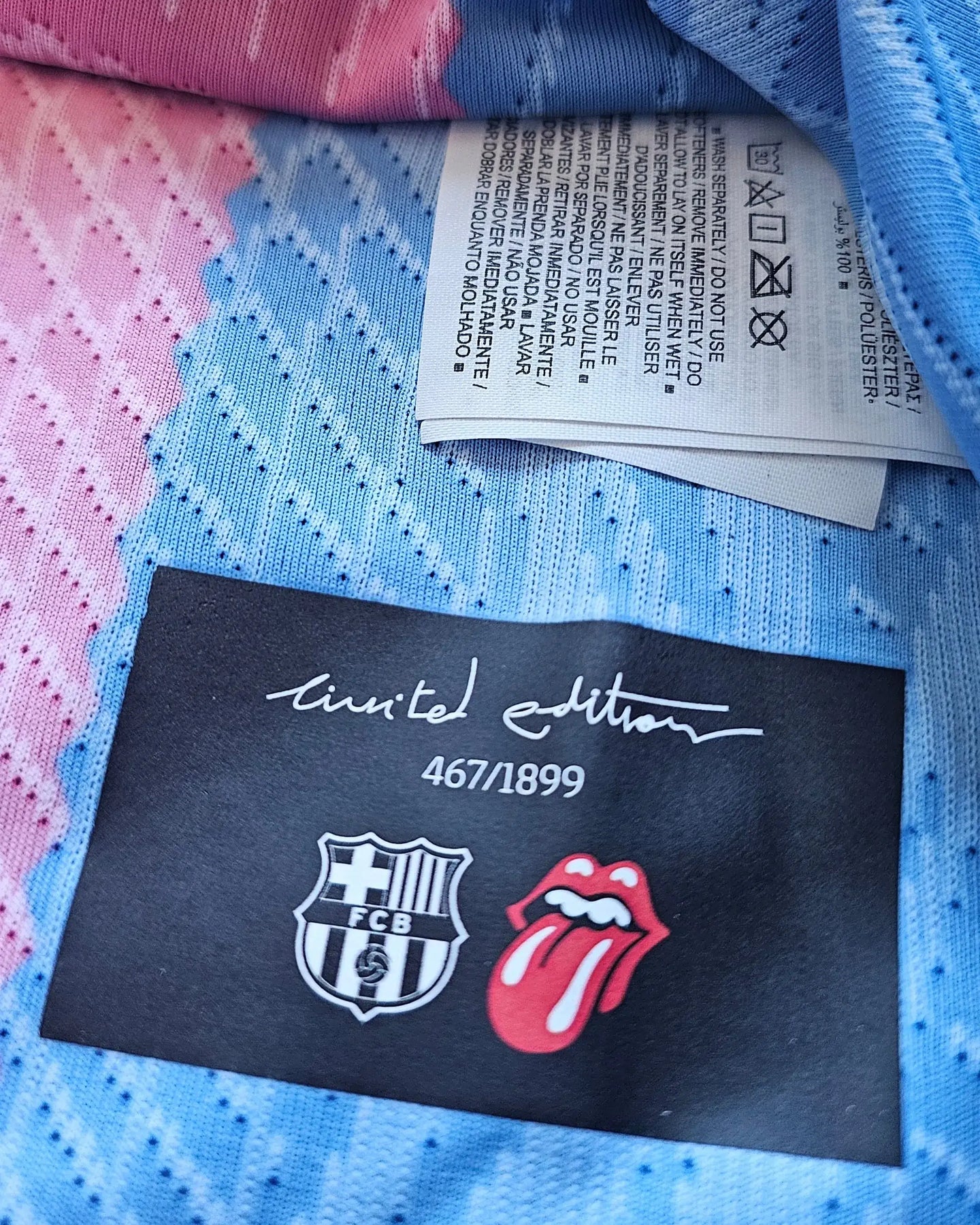 Limited edition tag showing 467/1899, FC Barcelona crest, and Rolling Stones logo.