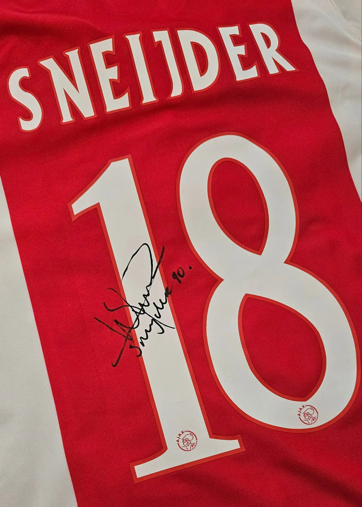Back view displaying the name SNEIJDER, number 18, and a visible signature.