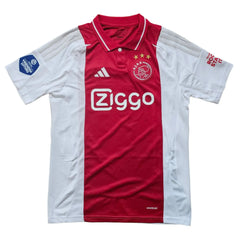 Front view of Mika Godts 11 Ajax football shirt with Ziggo logo and three stars on the crest.