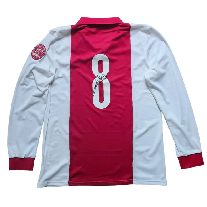 Back view showing No. 8 and signature of Sjaak Swart on a red and white football shirt.