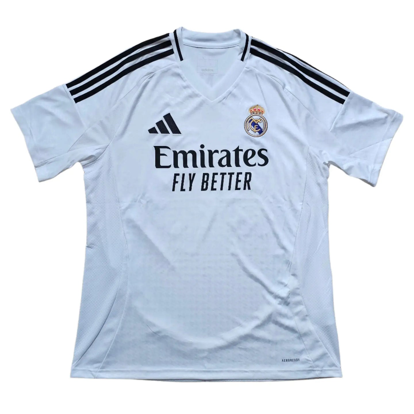 Front view of Raúl Asencio 35 Real Madrid 2024-2025 soccer jersey featuring the Emirates logo.