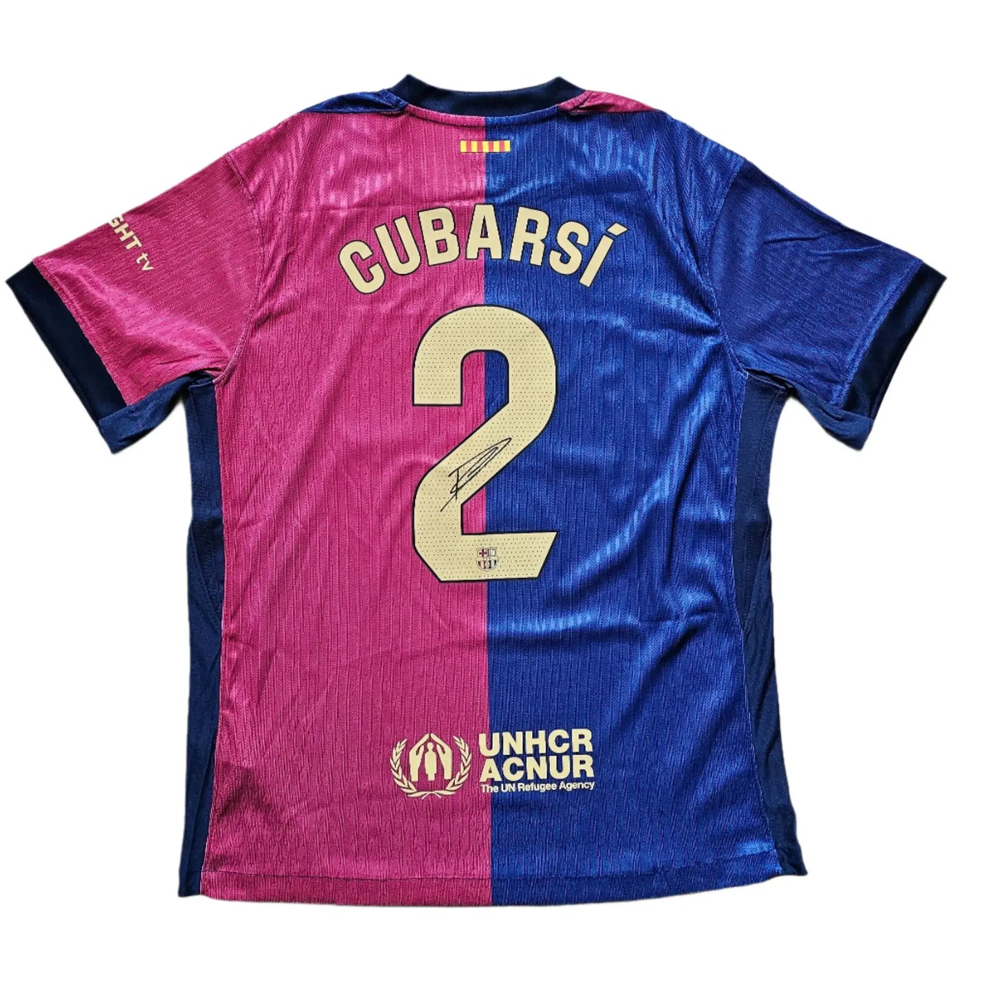 Back view showing Cubarsí, No. 2, and signature on a blue and red soccer jersey.