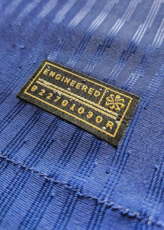 Close-up of the engineered label with text 'ENGINEERED' and code 'B22701030R'.
