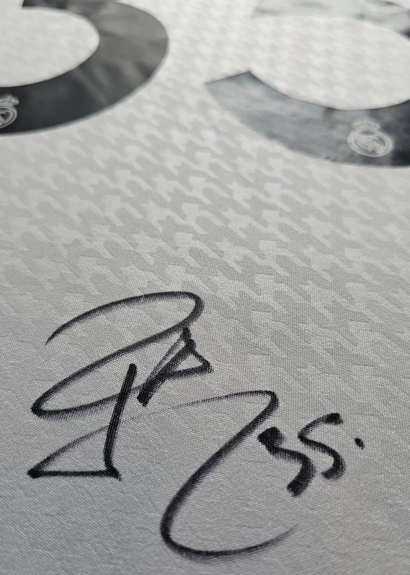 Close-up of the No. 35 with signature detail on the jersey for Raúl Asencio.