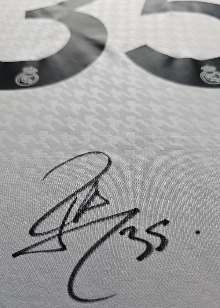 Close-up of signature on Real Madrid football shirt with No. 35.
