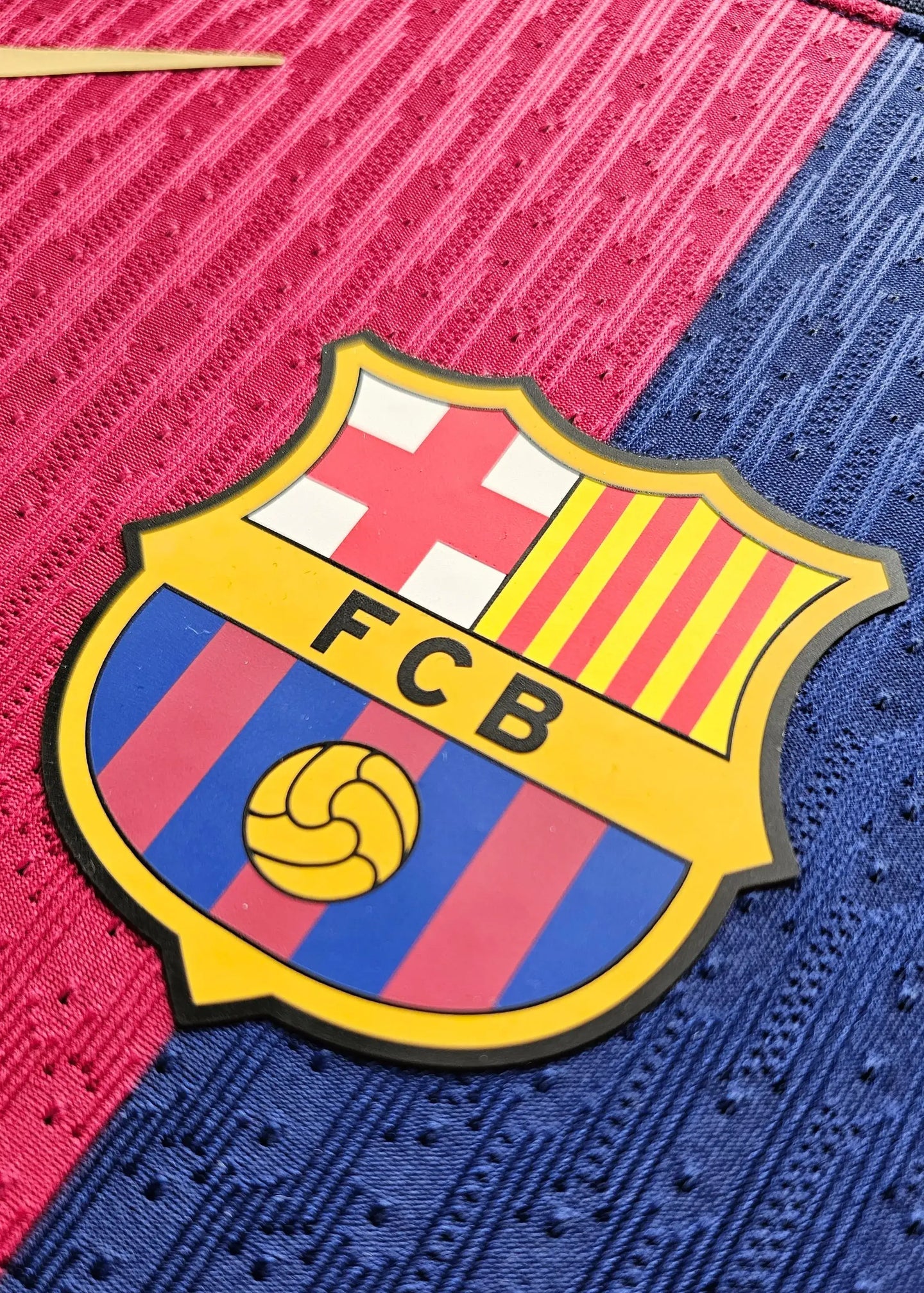 Crest detail featuring FC Barcelona logo with red and blue stripes and yellow accents.