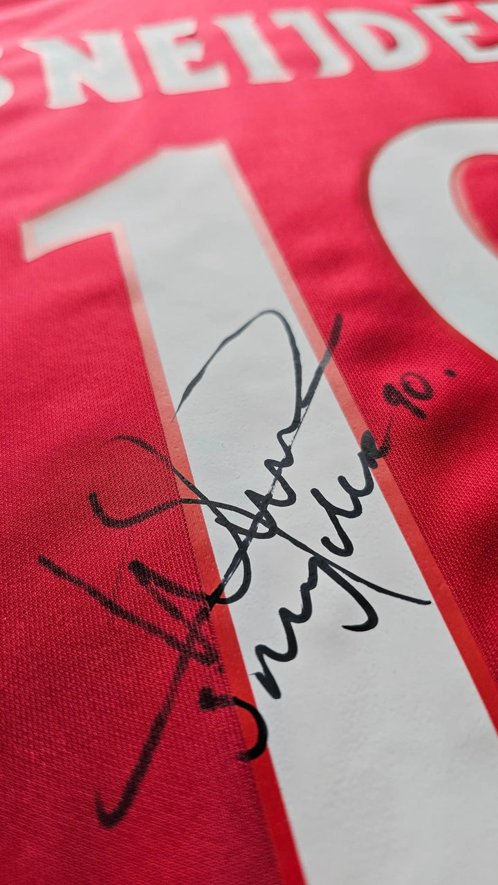 Detail view featuring signature of Sneijder on the red shirt with No. 18.