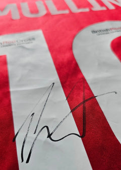 Signature of Mullin on the No. 10 Wrexham AFC soccer jersey in red.