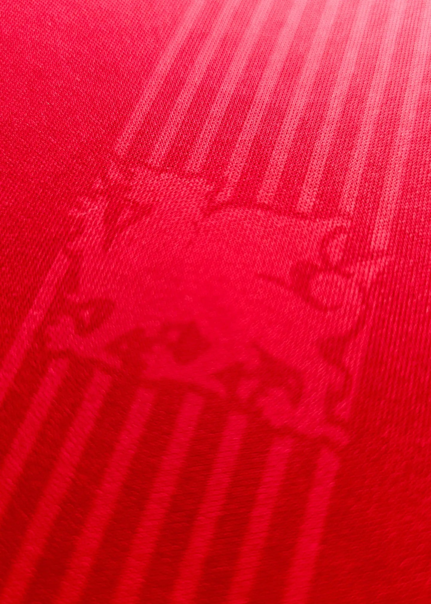Crest detail showing red background with embossed Wrexham AFC crest visible.