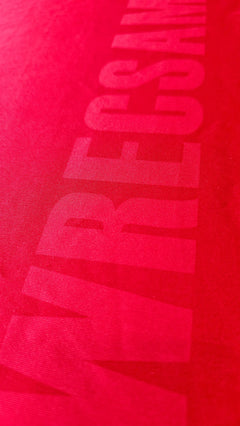 Close-up view of Wrexham AFC lettering on a red signed soccer jersey by Phil Parkinson.