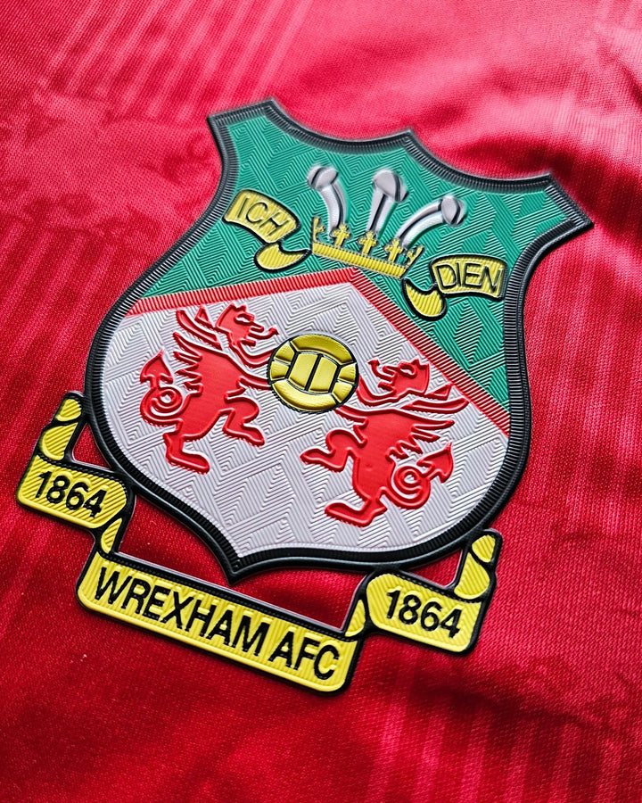 Crest detail showing Wrexham AFC badge with two red dragons and &