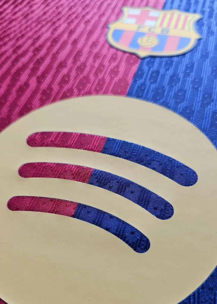 Crest detail featuring FC Barcelona logo and Spotify branding in blue and red hues.