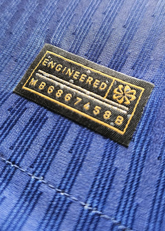 Close-up showing the engineered label with text 'ENGINEERED' and code 'MB6867458B'.
