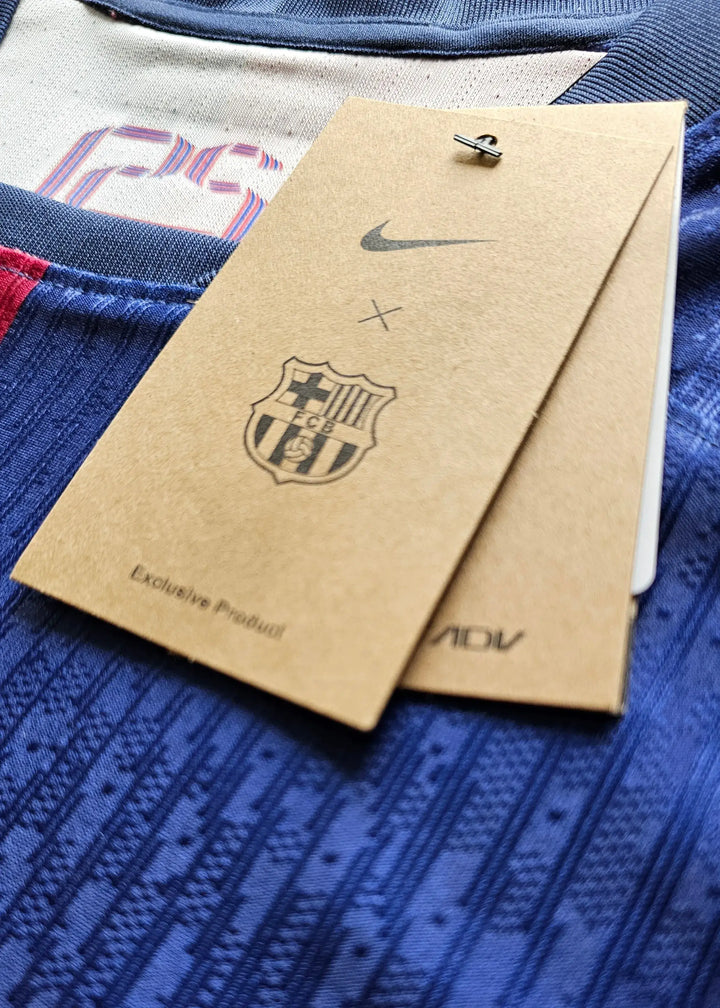 Detailed view of FC Barcelona tag featuring Nike logo and crest, with visible text stating 'Exclusive Product'.