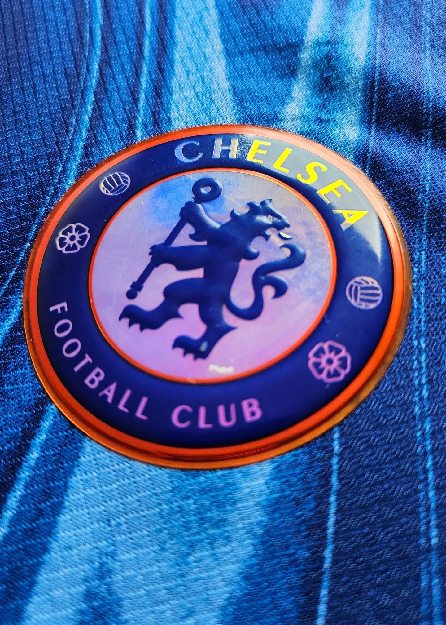 Detail view of the Chelsea F.C. crest with lion emblem and 'CHELSEA FOOTBALL CLUB' text.