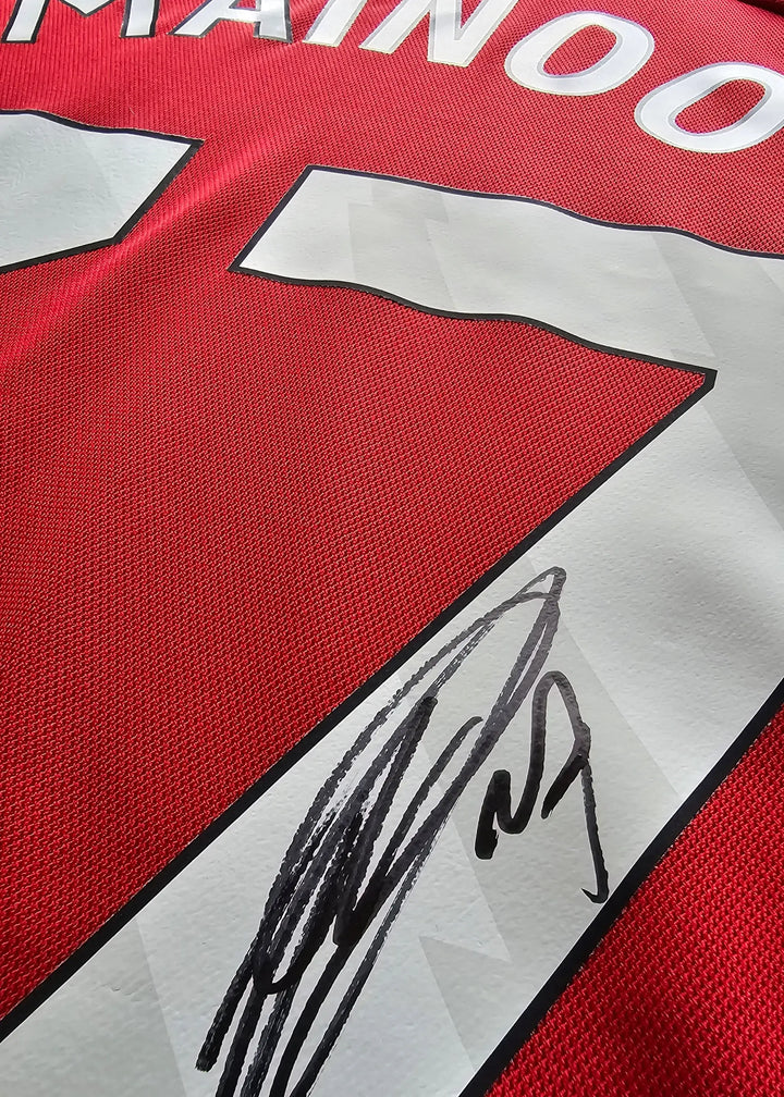 Signature of Kobbie Mainoo on the red No. 37 Manchester United football shirt.