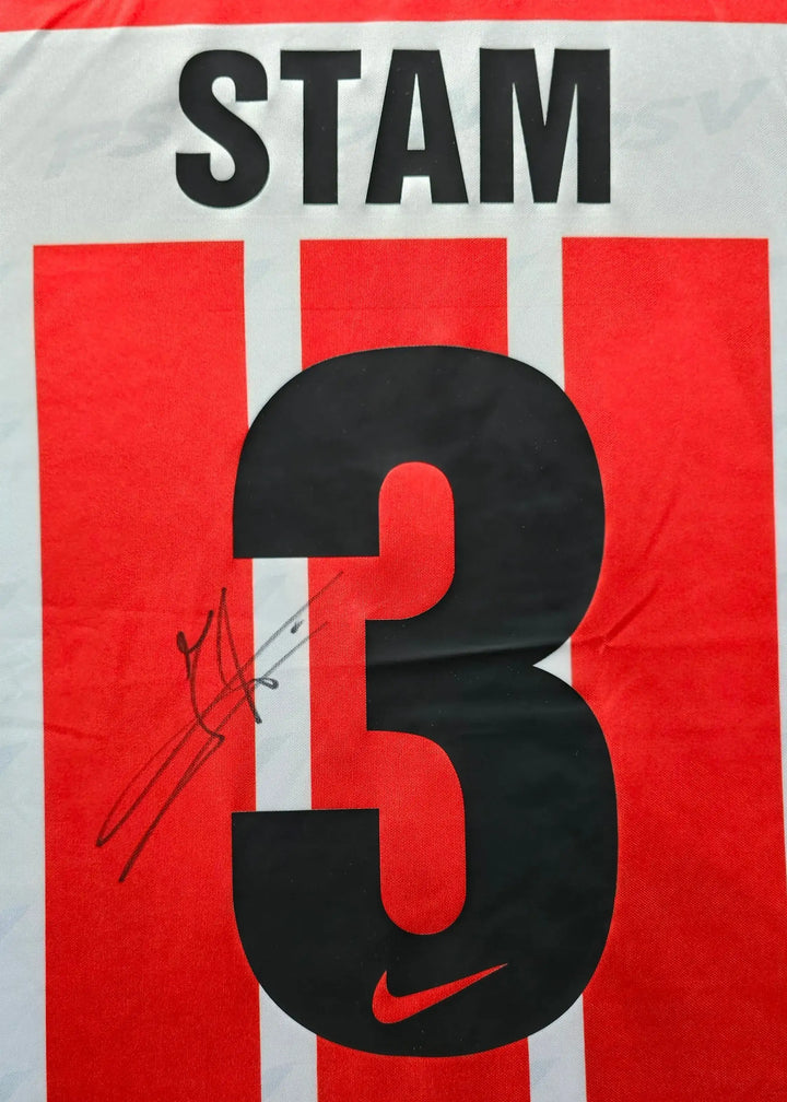 Back view featuring No. 3, player name STAM, and a visible signature.