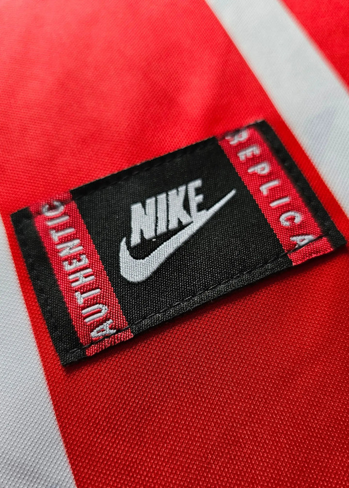 Close-up of Nike label reading &