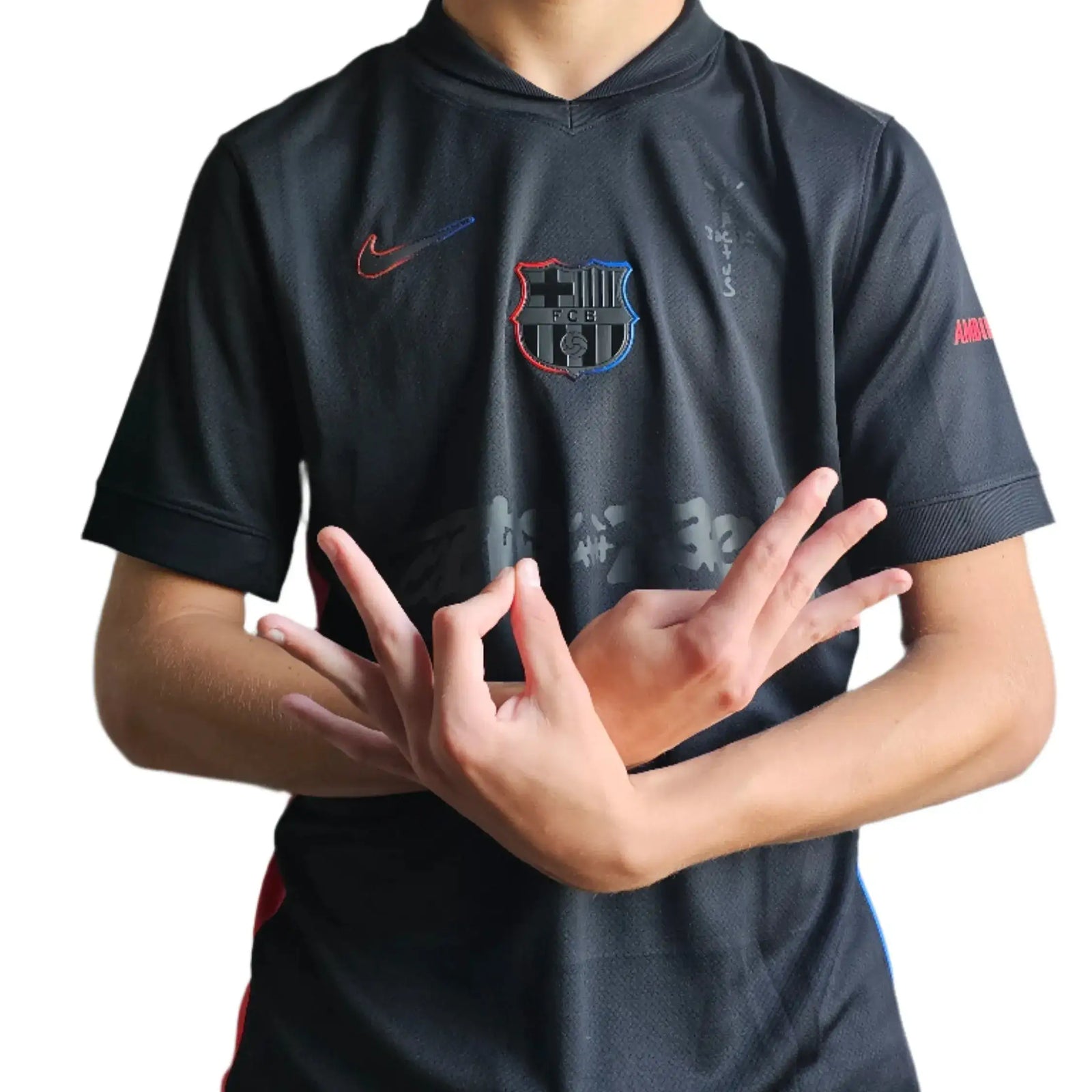 Front view of the FC Barcelona 2025 Travis Scott black soccer jersey featuring the crest and Nike logo.