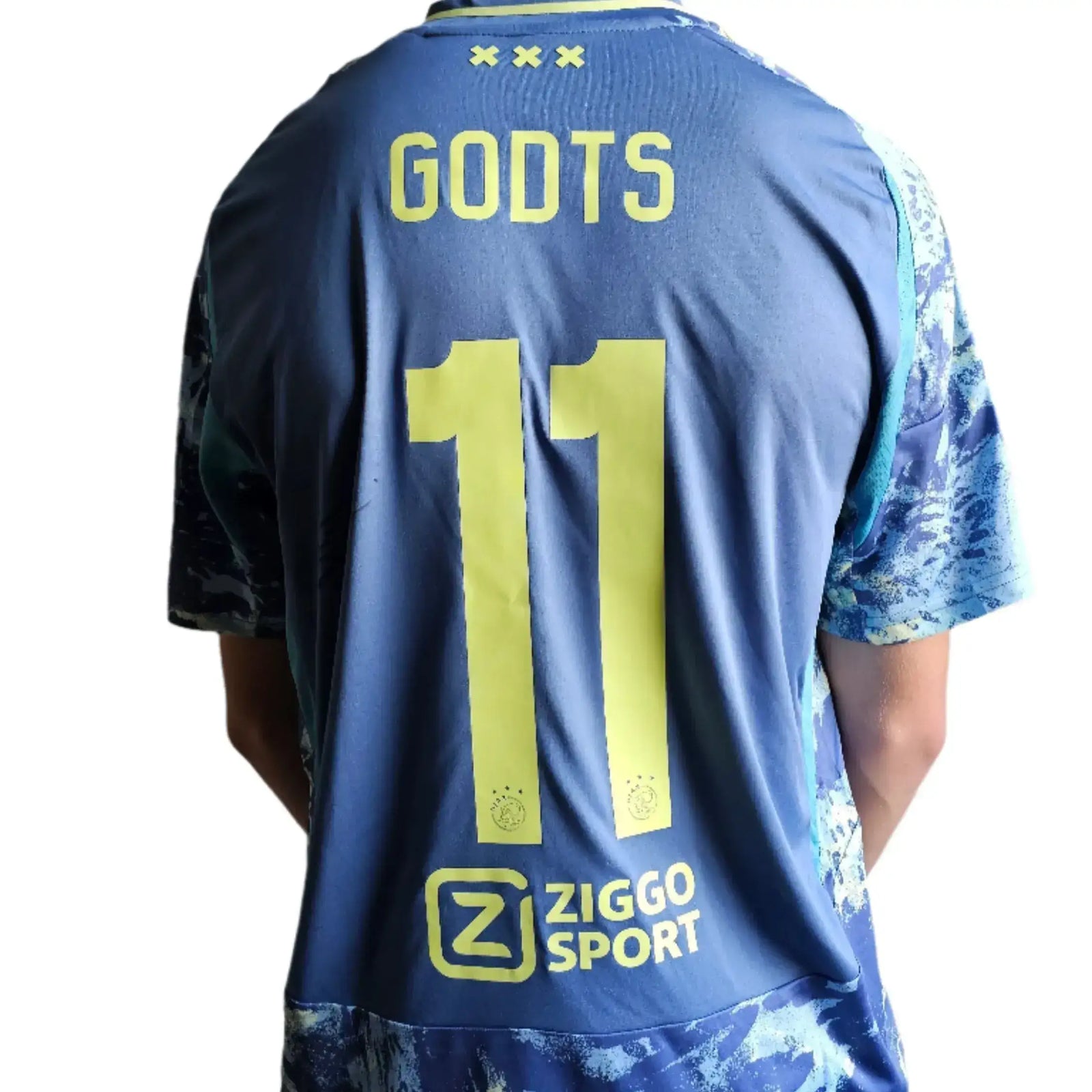 Back view featuring Godts, No. 11, and Ziggo Sport logo in yellow on blue shirt.