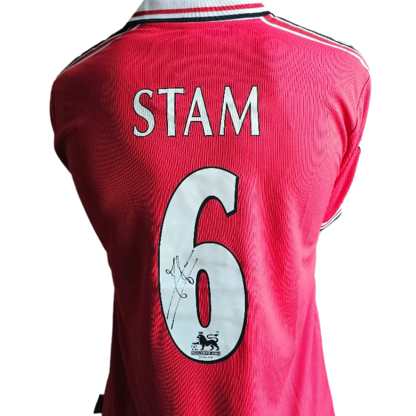 Back view displaying No. 6 and the signature of Stam on a red Manchester United football shirt.