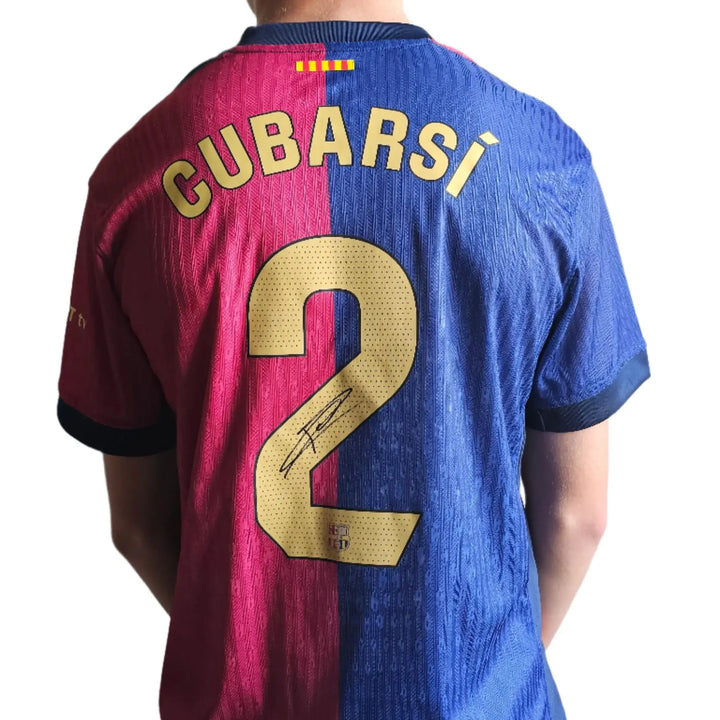 Back view showing Cubarsí, No. 2, and a visible signature on the Barcelona football shirt.