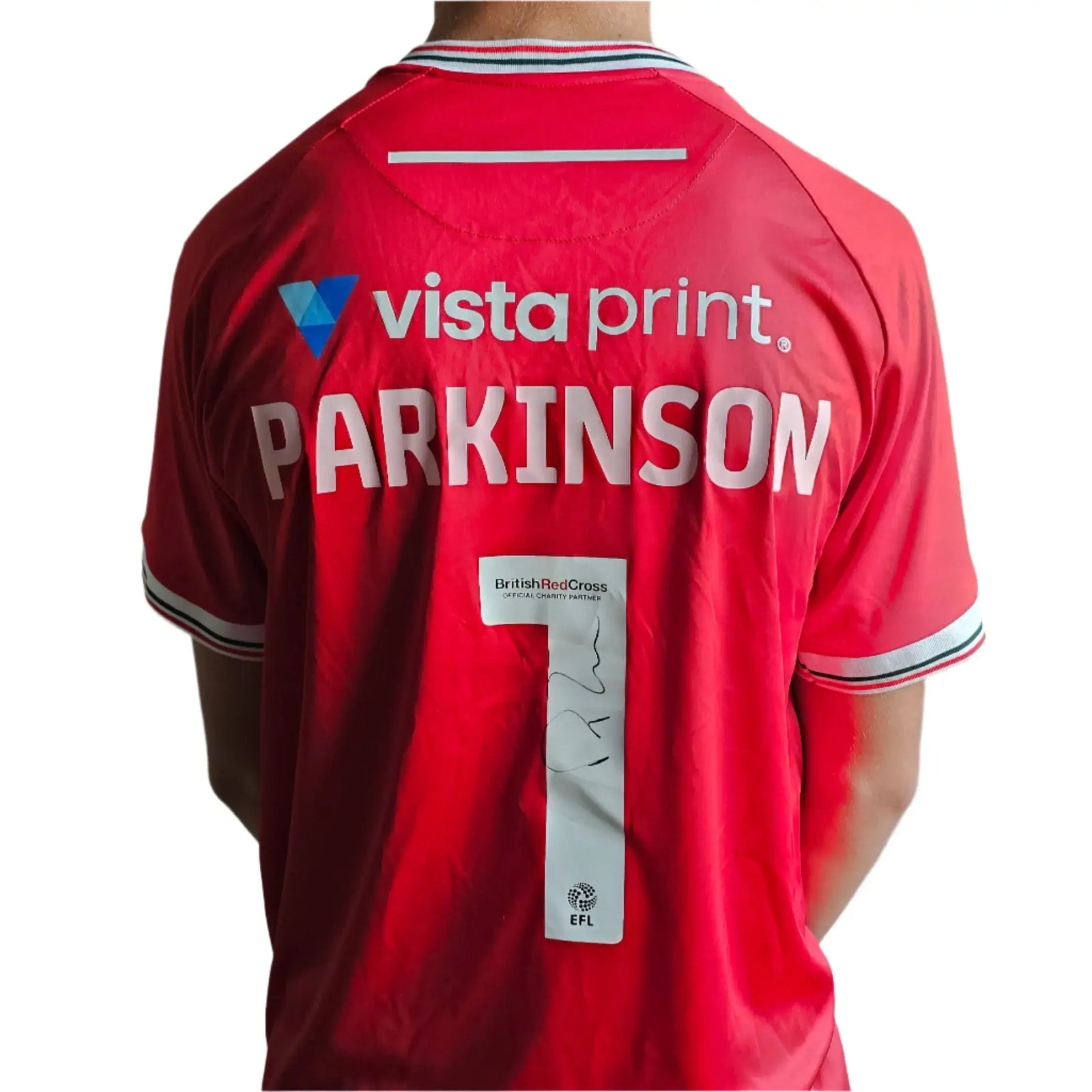 Back view showing PARKINSON, No. 1, and a visible signature on a red soccer jersey.