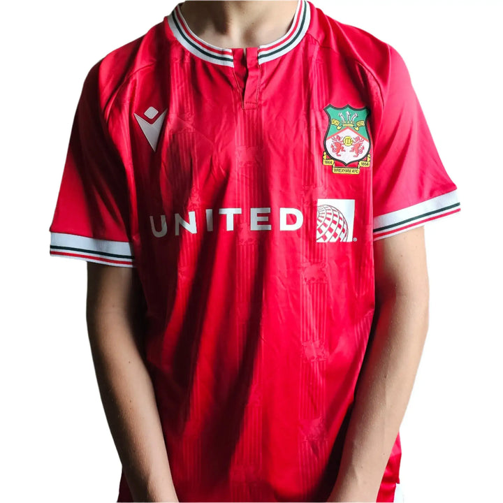 Front view of a red Wrexham AFC soccer jersey featuring &