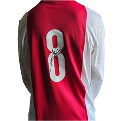 Back view showing No. 8 and Sjaak Swart's signature on a red and white football shirt.