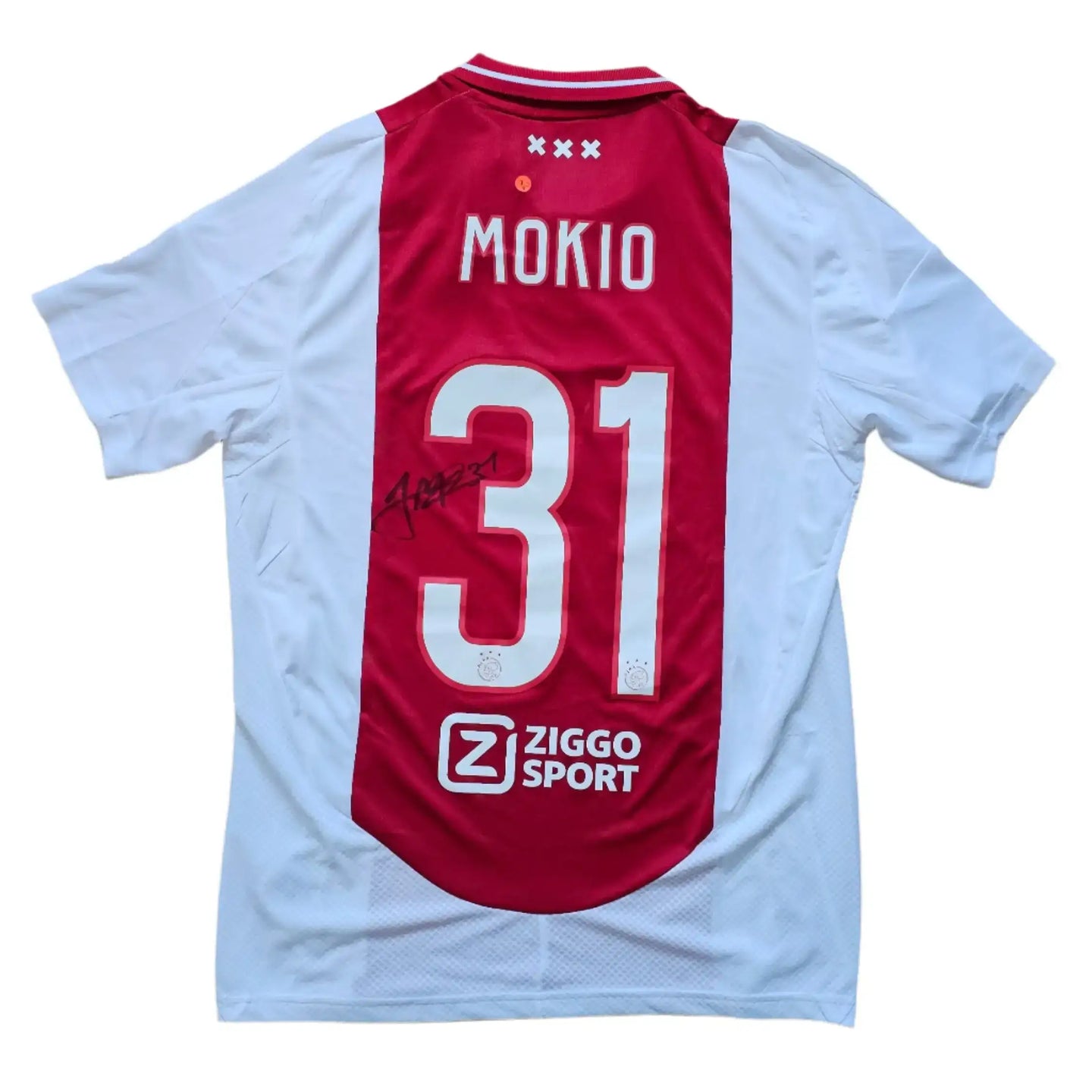 Back view showing No. 31 and Mokio's signature, with Ziggo Sport logo visible.