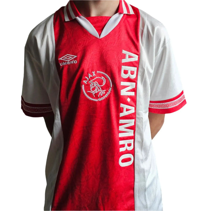 Front view featuring red and white Ajax shirt with ABN AMRO logo and Ajax crest.