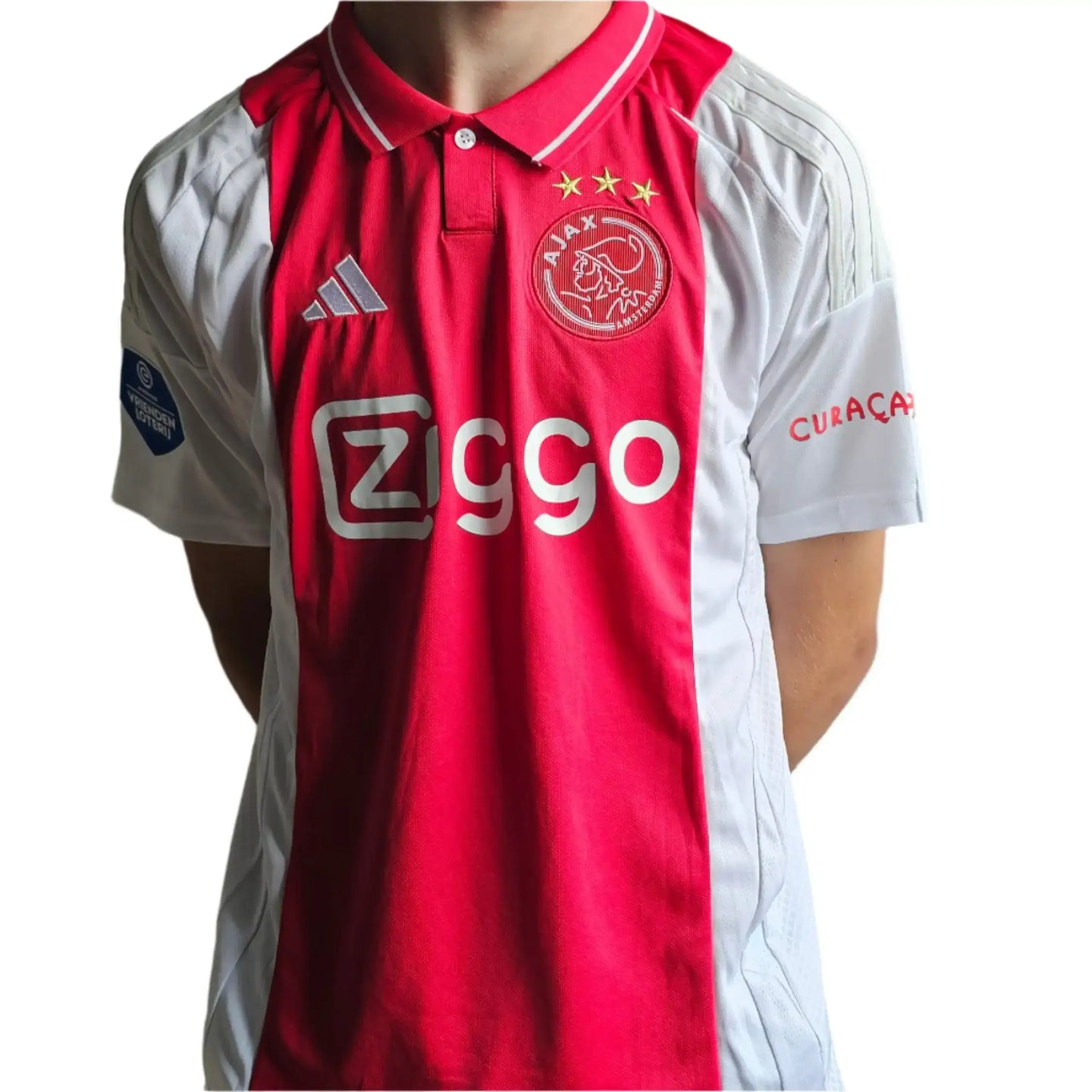 Front view of Ajax football shirt featuring the Ziggo sponsor and three crest stars.