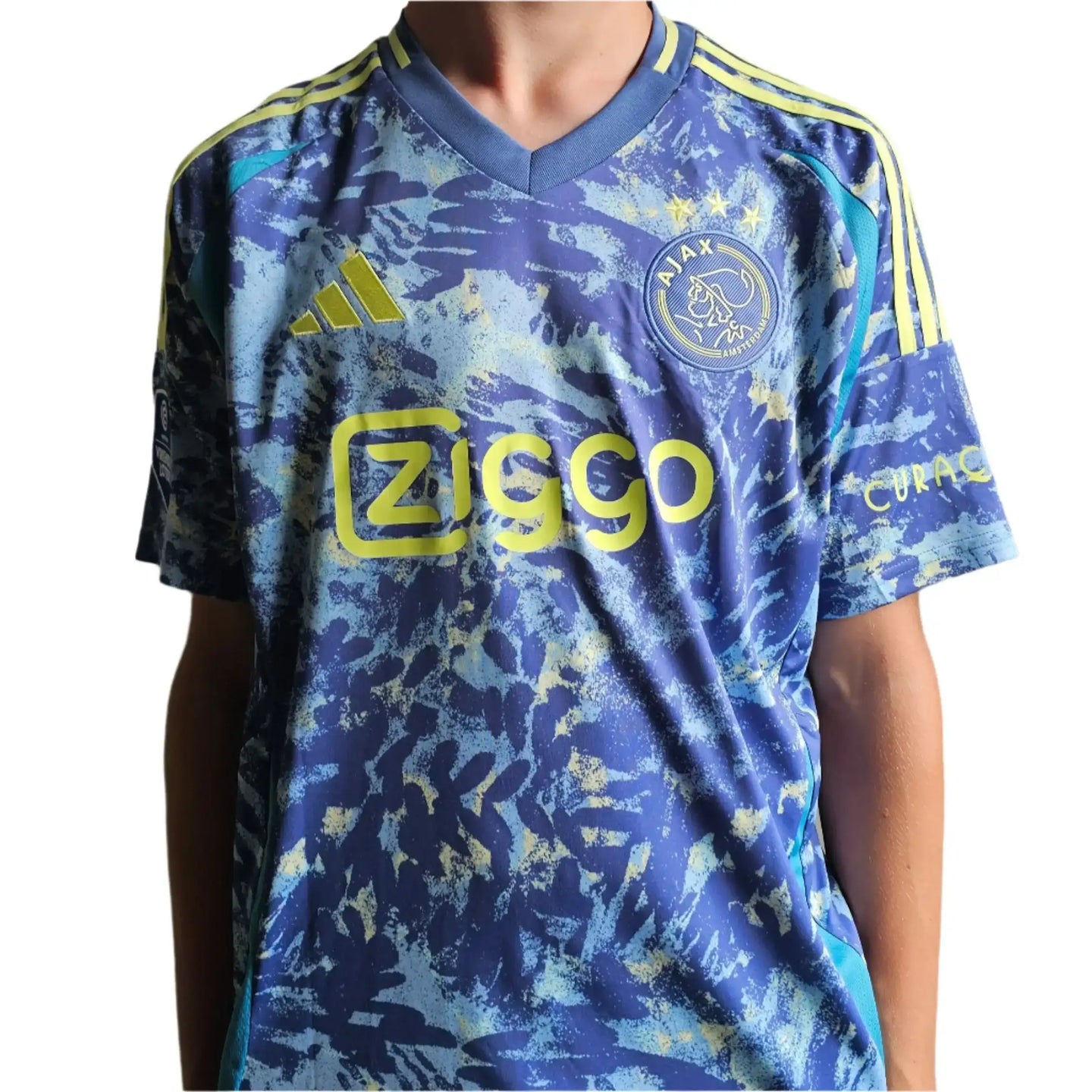 Front view of Brian Brobbey signed Ajax football shirt featuring Ziggo logo and Ajax crest.