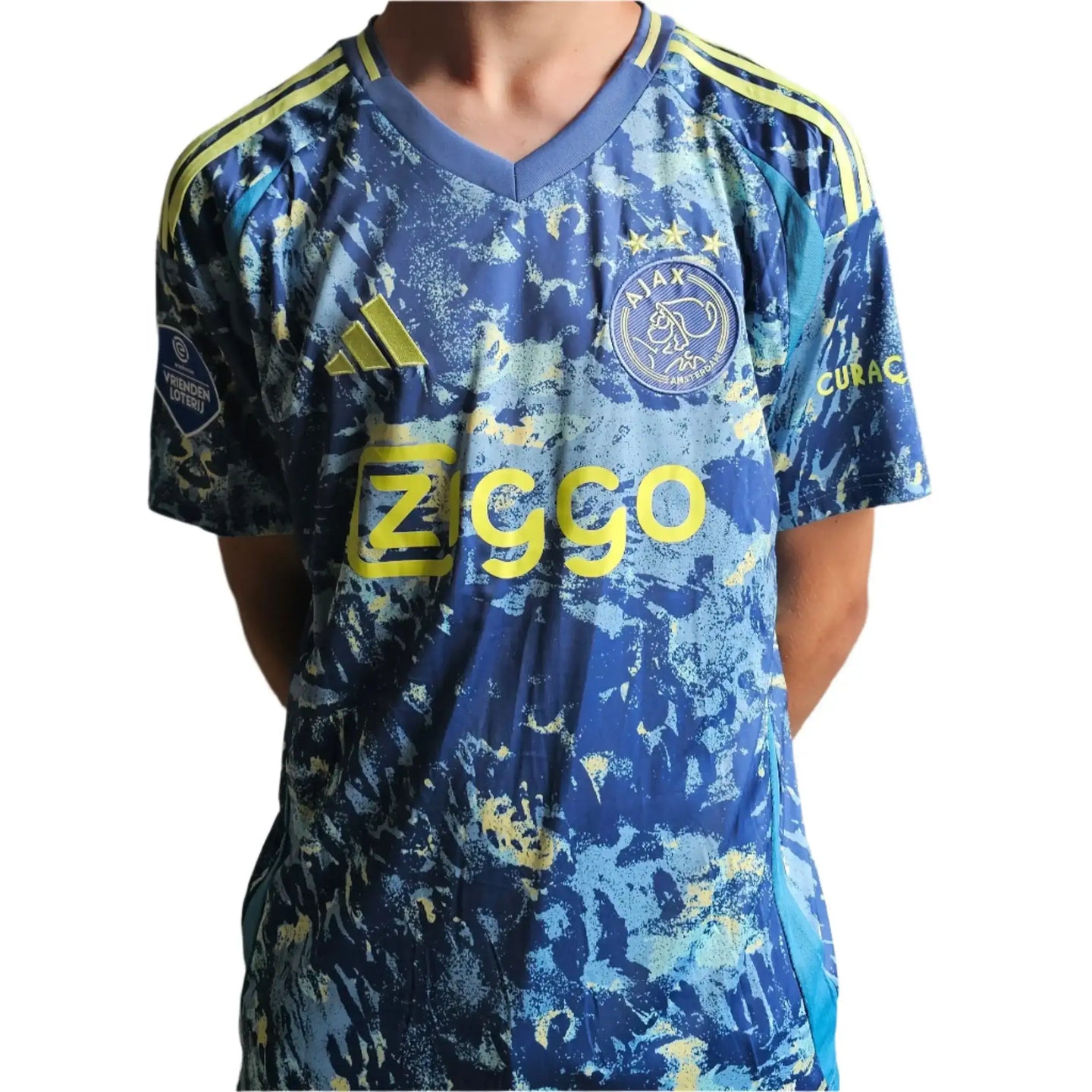Front view of the Brian Brobbey signed Ajax football shirt featuring Ziggo logo and Ajax crest with three stars.