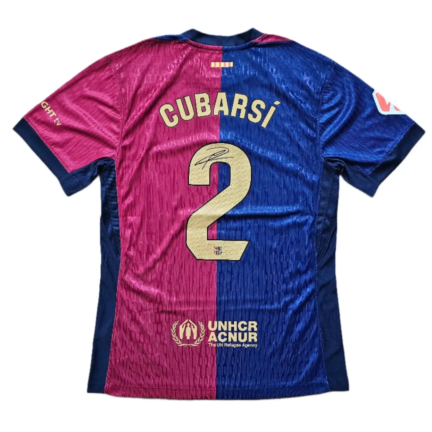 Back view showing Cubarsí, No. 2, and UNHCR sponsor logo on Barcelona football shirt.