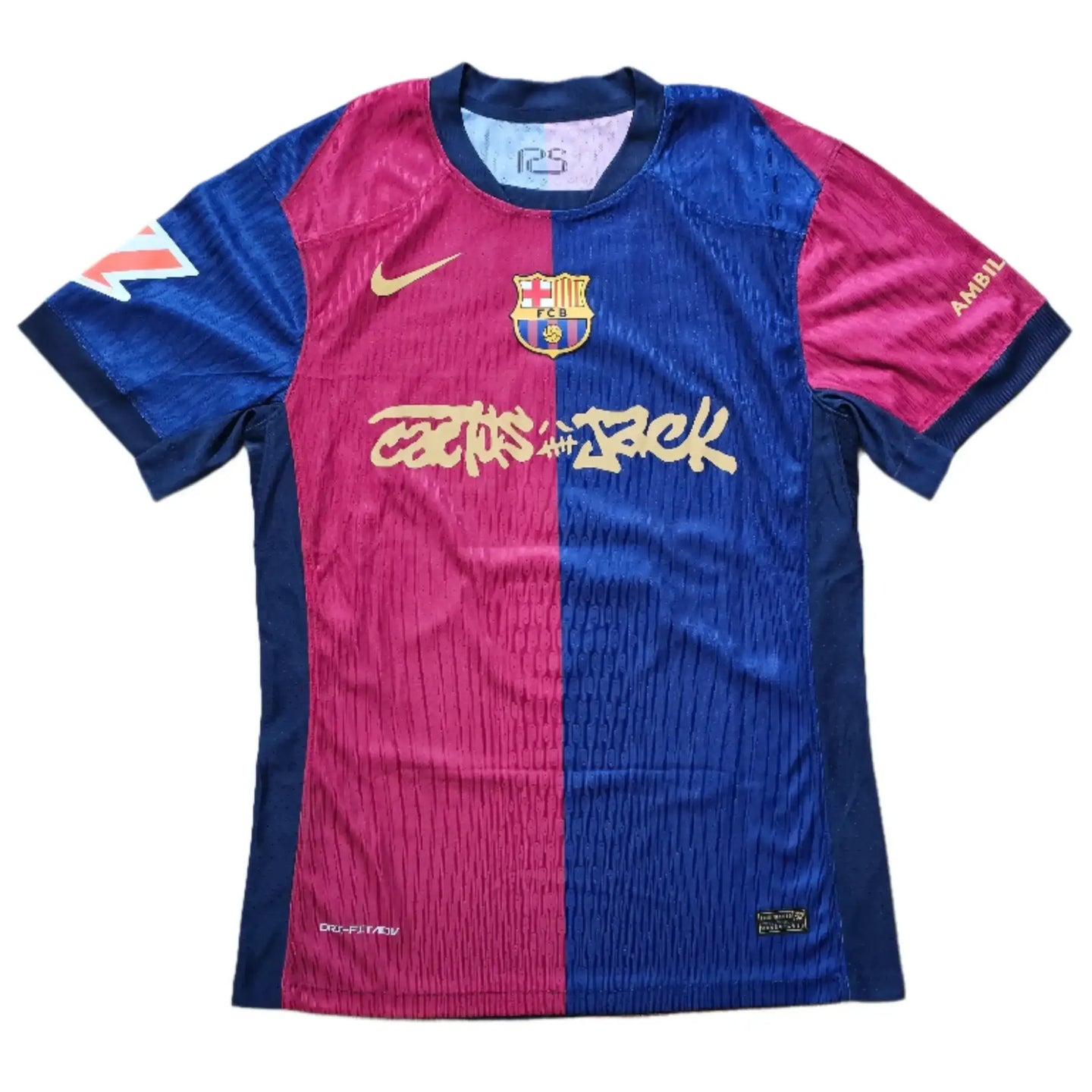 Front view of a signed Barcelona football shirt featuring Cactus Jack artwork and the club crest.