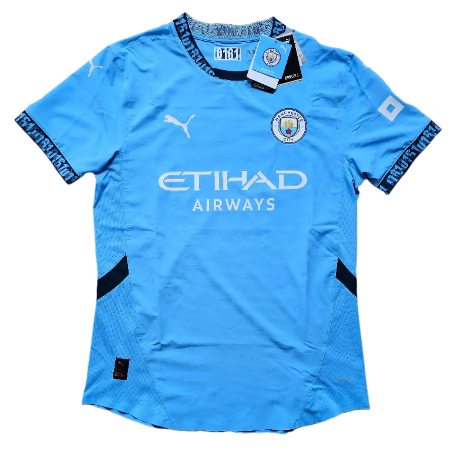 Front view showing Manchester City crest, ETIHAD AIRWAYS, and Puma branding on a blue football shirt.