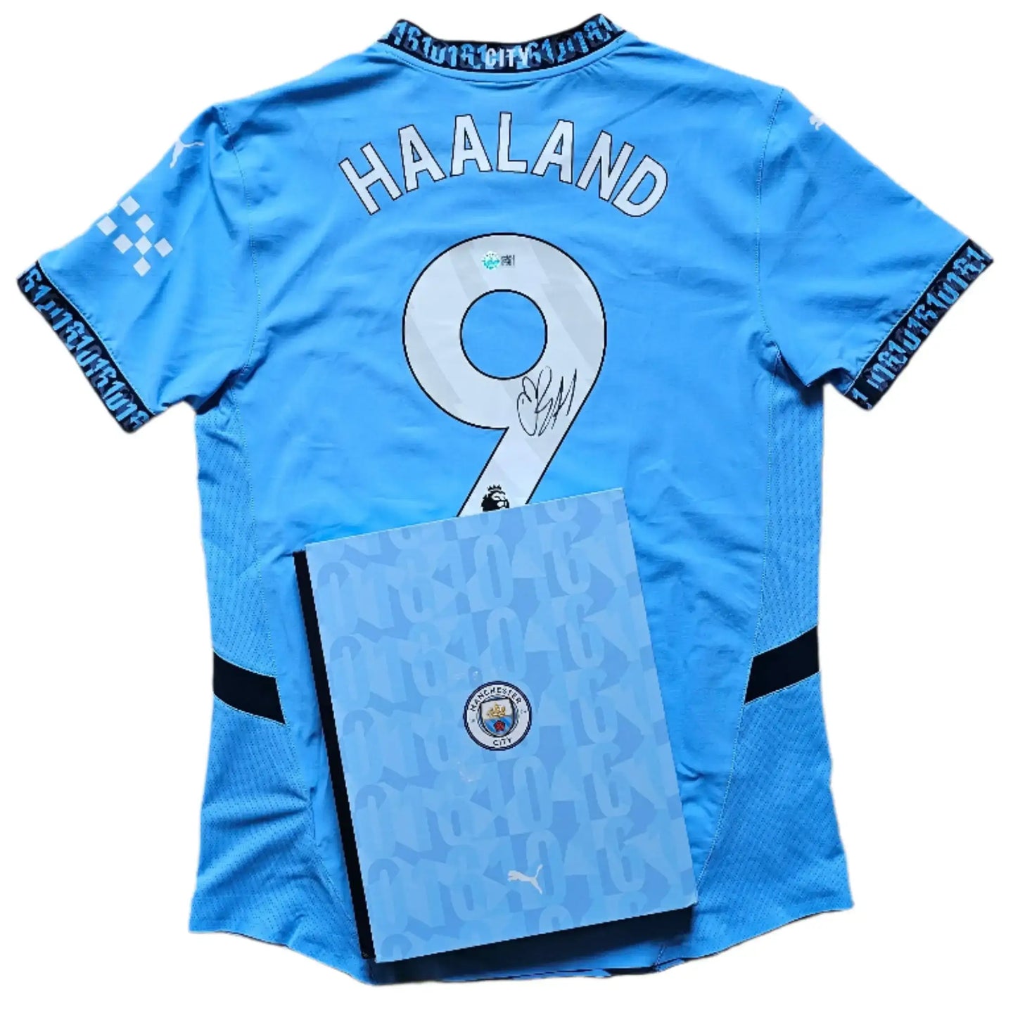 Back view showing No. 9 and Haaland's signature on the Manchester City football shirt.