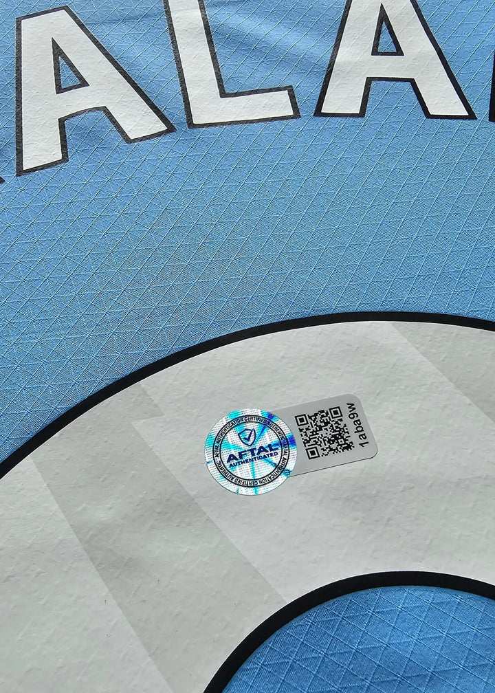 Close-up view of the AFTALS authentication sticker on Erling Haaland&